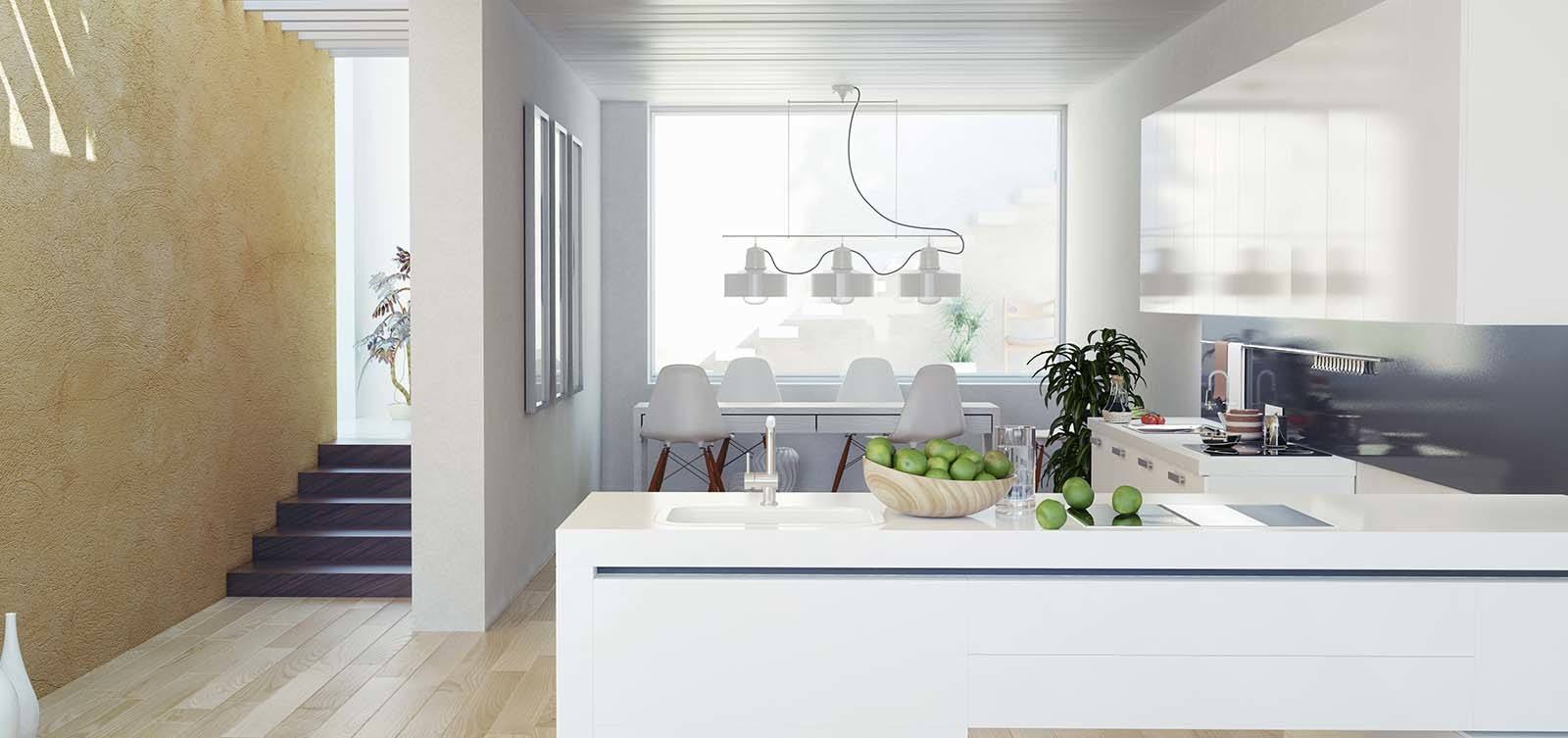 Bright modern kitchen and dining area with white cabinetry, large windows, and contemporary lighting.