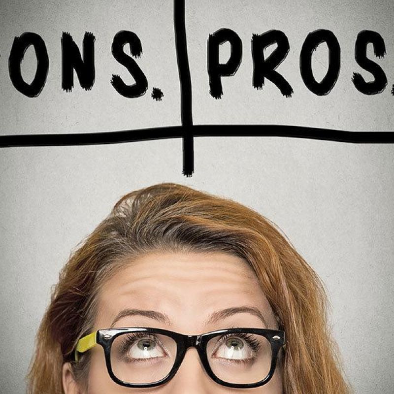 Woman in glasses thinking about pros and cons, concept decision-making chart above her head.