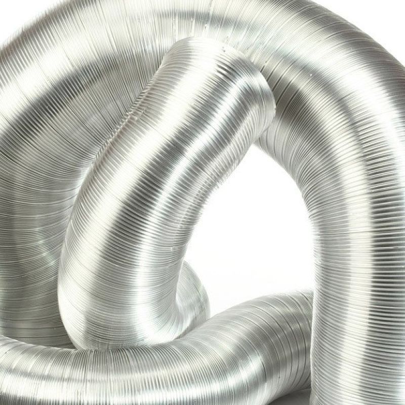 Shiny metal coil duct in abstract shape, ideal for HVAC systems and flexible ventilation solutions.