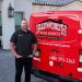 Man standing by Ellsworth Air Conditioning & Plumbing  van, offering heating, insulation, and ventilation services.