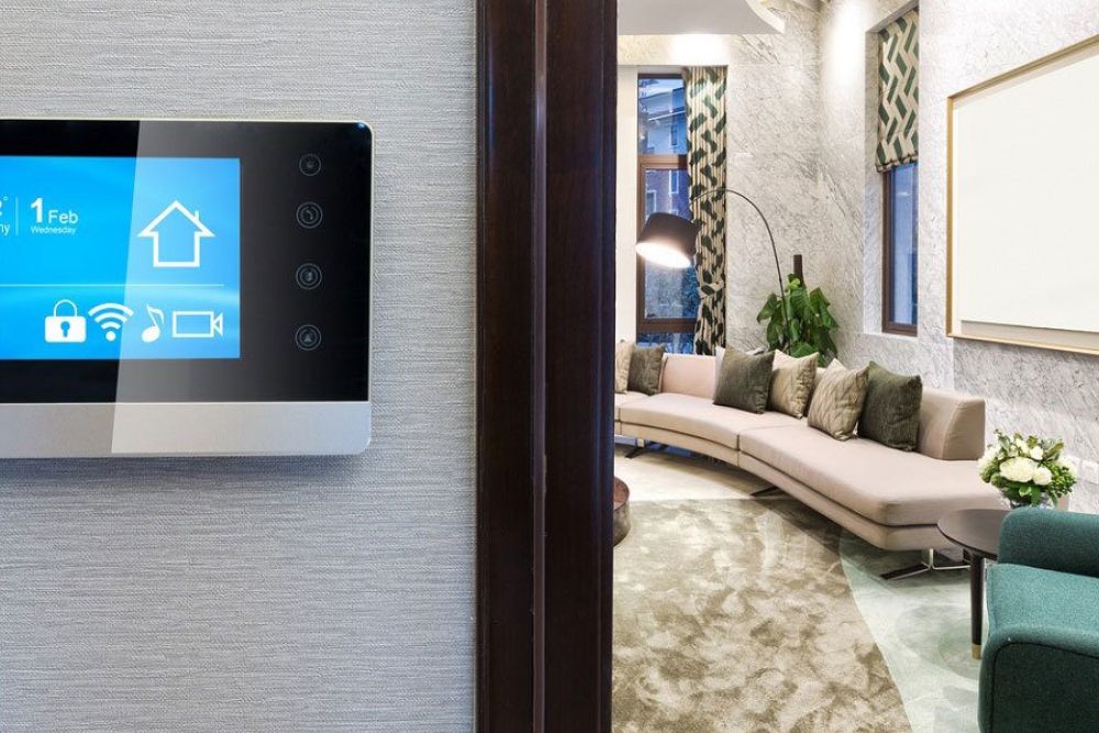 Smart home display showing temperature and settings in a modern, elegantly designed living room.